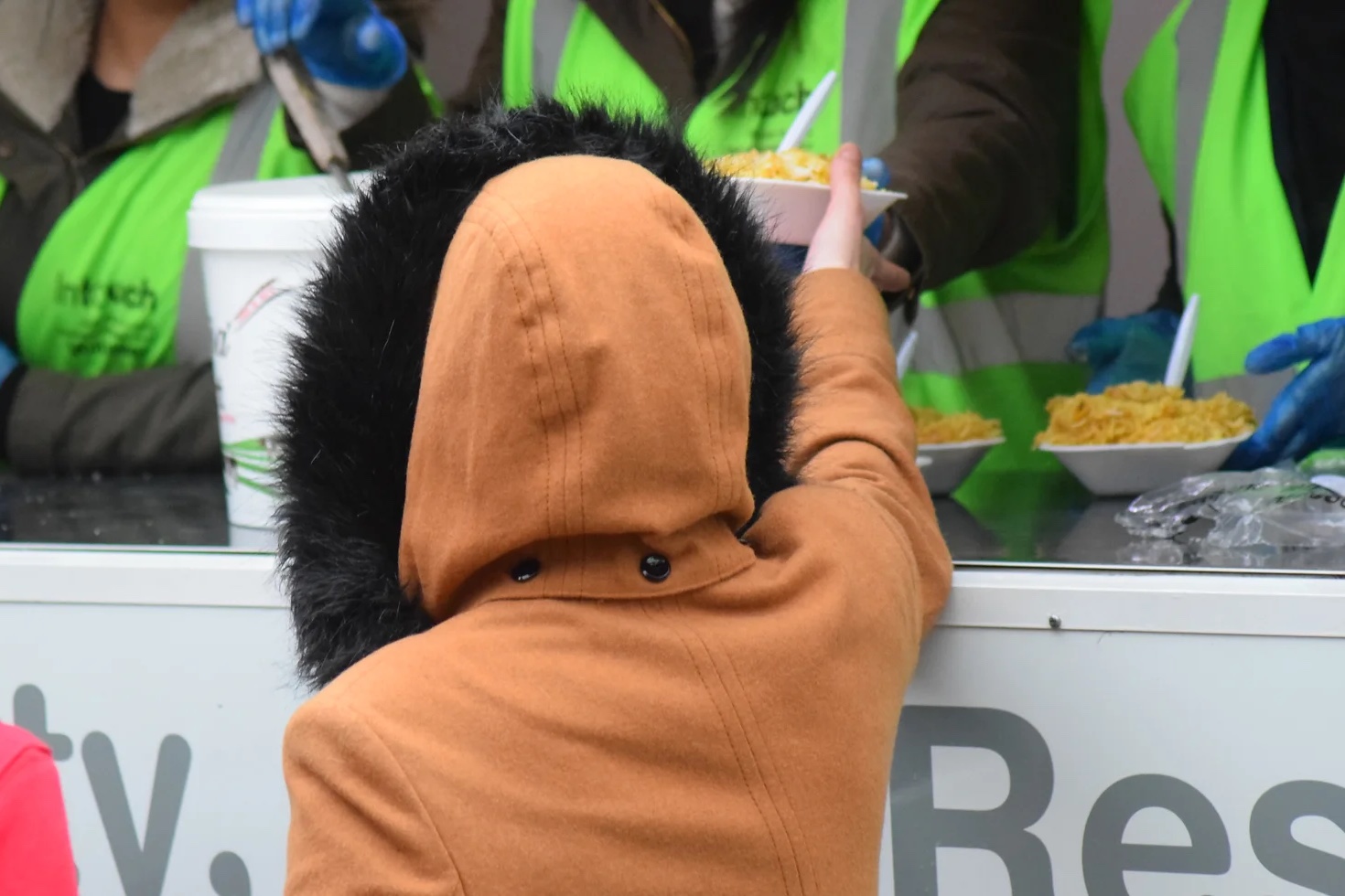 Intouch Foundation volunteers distributing food to the homeless people at the Food Kitchen project
